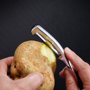 Pelador de acero inoxidable para patatas, manzanas, frutas y verduras, herramienta de cocina con cuchilla afilada para pelar fácilmente - Product Image 1