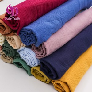 Tessuto Crêpe in <span class=keywords><strong>Mussola</strong></span> a Doppio Strato 100% Cotone Biologico Tinta Unita Multicolore per Pagliaccetti o Camicie Senza Maniche da Neonato - Product Image 1