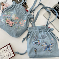 Sac à cordon en jean brodé grande capacité, tendance, à porter à l'épaule ou à la main, idéal pour l'école et le Nouvel An