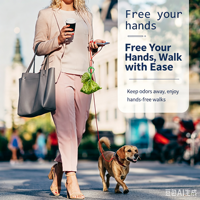 Nouvel arrivage : Distributeur de sacs à déjections mains libres portable avec clip de fixation pour laisse, idéal pour les promenades en extérieur avec votre chien