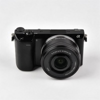 Appareil photo hybride compact A5100 d'occasion avec kit 16-50mm OSS, 24 MP APS-C, WiFi, écran tactile orientable, fonction selfie, vidéo professionnelle et éclairage pour objectifs E-mount
