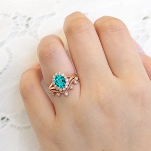 แหวนหมั้นเพชรพลอยพาราไบต์สังเคราะห์ทรงรีชุบทองคำแท้ S925 ดีไซน์ดอกไม้ สำหรับภรรยา ชุดแหวนแต่งงาน - Product Image 6