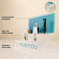 Expositor de Maquillaje Acrílico Plegable de 2 Niveles, Diseño Moderno de Mr Lui, para Farmacias y Comercios