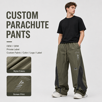 Private Label Herren Fallschirmhose Nylon Weites Bein Kordelzug-Bund Siebdruck Verstellbarer Saum Lässige Streetwear-Hose
