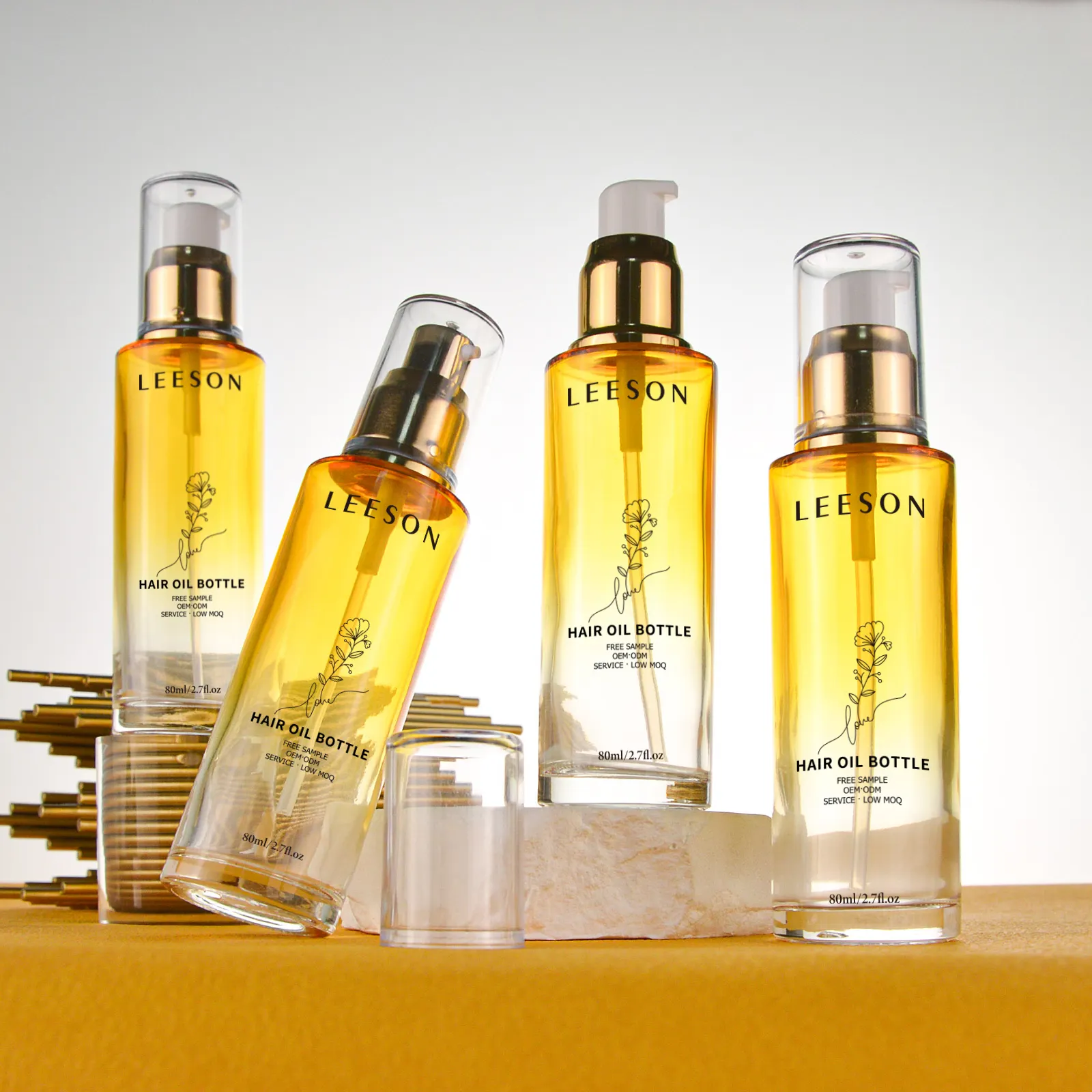 Bouteille cosmétique de luxe unique en verre vide pour huile capillaire sérum lotion avec tête de pompe en plastique dorée