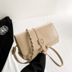 กระเป๋าสะพายคาดลำตัวทอพร้อมกระดุม - Product Image 1