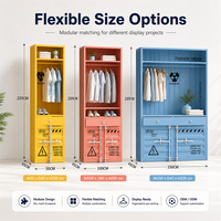 Armoire de présentation sur mesure de style conteneur avec tringles à vêtements, tiroirs, étagères et rangement de base pour les présentoirs de magasins de vêtements
