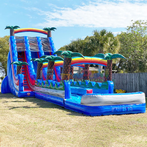 Structure gonflable géante pour enfants, thème tropical, avec toboggan aquatique double piste et piscine. - Product Image 1