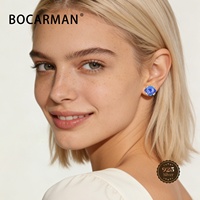 Vente en gros de zircone cubique synthétique de laboratoire 6*7mm en forme d'œil avec effet de couleur/effet feu, pierres précieuses synthétiques pour la fabrication de bijoux et le nail art DIY