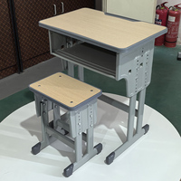 Ensemble de bureau et chaise individuels réglables pour étudiant avec tiroir et crochet pour cartable, plateau en HDF, idéal pour les salles de classe du primaire - Vente en gros