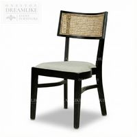 Chaise de salle à manger moderne de style mid-century en bois noir avec dossier en rotin, siège rembourré, idéale pour hôtels, événements extérieurs, mariages, prête à la location