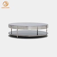 Table basse ronde à double niveau avec rangement, plateau en verre trempé noir et structure circulaire en acier inoxydable, style contemporain