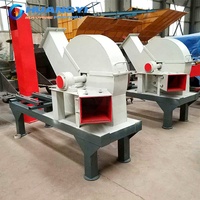 Broyeur à disques haute efficacité pour le traitement des bûches de 15 à 45 cm avec alimentation par convoyeur pour la fabrication de pâte à papier et de planches de bois