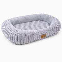 Lit pour animaux de compagnie en velours côtelé à poils coupés de forme ovale, avec rebord épais et éponge haute densité, pour chiens et chats, tailles S à XL, vente en gros