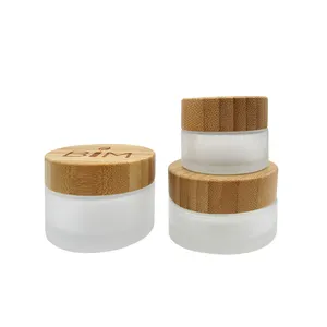 Cosmetic Cream Round Shaped 5g 10g 15g 30g 50g 100g 200g Clear Frosted Glass Jars With Engraved Bamboo Lid