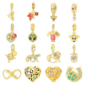 Made of white brass, plated with <b>gold</b> and set with zircon, and decorated with animal, heart, and symbol patterns - Product Image 1