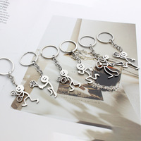 Porte-clés de couple en acier inoxydable, motif stickman sportif de boxe, accessoire amusant et original, porte-monnaie, en métal, vente chaude transfrontalière
