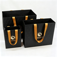 Fournisseur de sacs en papier pliables noirs personnalisés pour emballages de luxe de boutiques de mariage, de produits cosmétiques, de rouges à lèvres, de perruques et de cadeaux