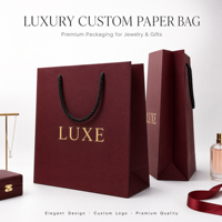 Sac cadeau en papier bordeaux de luxe avec logo en feuille d'or, poignées en corde torsadée renforcées, artisanat exquis