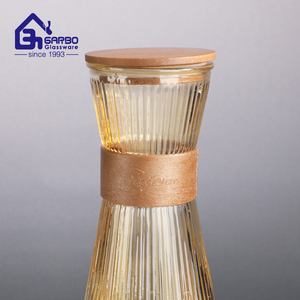 <span class=keywords><strong>2025</strong></span> thiết kế mới mỏng khắc thiết kế giá rẻ giá 920ml màu nước thủy tinh bình bình với kín nắp tre và tay áo - Product Image 5