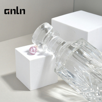 Vente en gros de flacons de parfum en verre transparent de 150 ml et 230 ml, disponibles pour logo et couleur personnalisés