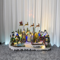 Oeuvre de Village de Noël directe d'usine avec lumière LED résine d'artisanat de traîneau de renne mobile pour centre commercial taille personnalisée