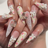 Vente en gros de faux ongles en acrylique de style français |   Charmes personnalisables en dentelle rose nude avec nœud 3D et strass, forme amande, longueur longue
