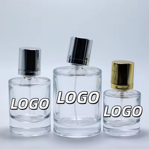 Vente en gros de flacons de parfum ronds en verre transparent de 30 ml, 50 ml et 100 ml avec bouchon argenté - Product Image 1