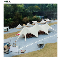 Tente innovante en forme d'étoile pour les séjours en plein air dans les centres de glamping avec tissu résistant aux intempéries, parfaite pour l'expérience d'observation des étoiles