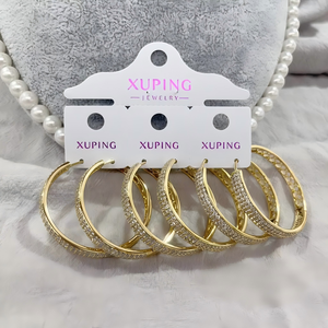 أقراط دائرية كبيرة بالجملة من XUPING مطلية باللون الذهبي بتصميم مجوف بالكامل للنساء كإكسسوار مميز للحفلات - Product Image 1