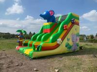 Château gonflable commercial sur le thème de la ferme avec toboggan pour parc d'attractions