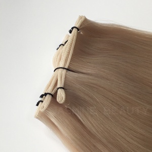 ผมต่อแบบเวอร์จินรัสเซียแท้ เกรด 60a ชนิด Genius Weft สีบลอนด์อ่อน  บางเฉียบ ไร้รอยต่อ น้ำหนัก 100 กรัม  แบบ Double Drawn  ผมแท้ Remy - Product Image 1