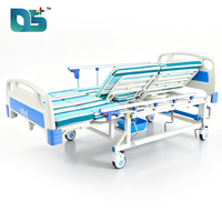 Lit d'hôpital manuel réglable à cinq fonctions avec cadre en acier, têtes de lit en ABS, table de toilette et table à manger mobile