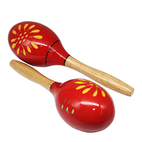 Maracas en bois à têtes rouges avec fleurs jaunes et vertes peintes à la main, boule de sable colorée de style dessin animé