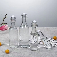 Bouteille de boisson transparente classique de 500 ml avec bouchon à bascule en verre et bouchon hermétique