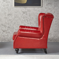 Fauteuil Chesterfield de luxe américain en cuir véritable vintage, fauteuil à dossier haut avec boutons capitonnés, accoudoirs roulés, canapé