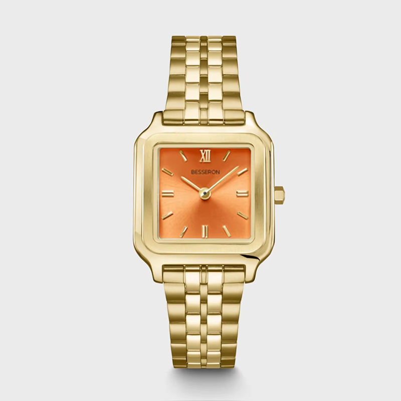Gold band orange dial watch