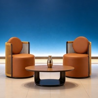 Fauteuil lounge moderne de luxe en corde tressée avec accents en cuir, coussin rond, pour hall d'hôtel, bureau, café, mobilier