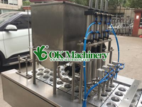 Machine de remplissage de tasse de dosage de liquide volumétrique automatique