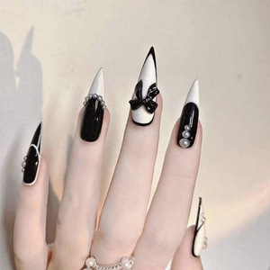 Ongles à presser en acrylique de qualité salon, réutilisables, noirs et blancs bicolores avec nœud 3D et perle pour soirées événementielles, vente en gros - Product Image 1