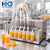 Machine de remplissage de sachets de jus M6 de table à six buses pour l'emballage de boissons aux fruits avec panneau de commande et positionnement des sachets préformés