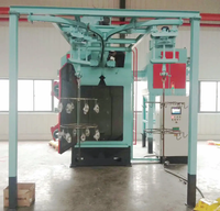 Machine de grenaillage électrique pour pièces d'estampage en métal Élimination de la rouille Cylindre GPL neuf état Traitement de surface à crochet Douk