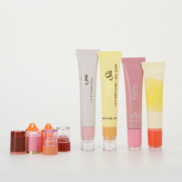 Tube de gloss à lèvres en forme de donut personnalisé, dégradé de couleurs, 10 ml, emballage cosmétique OEM ODM, tube en plastique à presser pour huile à lèvres
