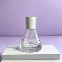 Flacon de parfum de luxe conique noir 10ml 50ml avec pulvérisateur à brume fine et bouchon en pierre, couleur personnalisée