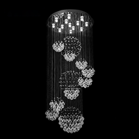 Grand lustre en cristal hélicoïdal avec sphères en cascade, hauteur réglable, lumière LED chaude pour la décoration de hôtels de luxe et de halls d'entrée