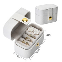 Boîte à bijoux de voyage ovale mini en cuir PU de luxe, personnalisable avec logo et bouton, pour bagues et boucles d'oreilles, vente en gros