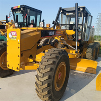Niveleuse Caterpillar 140H d'occasion avec moteur et pompe Mitsubishi, composants essentiels de qualité garantie, vente à prix réduit
