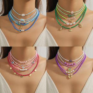 Vente en gros de bijoux tendance Collier multi-couches pour femmes avec chaîne de clavicule en pierre naturelle perlée Collier ras du cou en perles de <span class=keywords><strong>millet</strong></span> de Bohème - Product Image 1