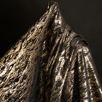 Vente en gros de tissu jacquard métallisé noir et or tissu ondulé tissu brocart à motifs irréguliers pour robe de créateur