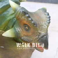 Sculpture de dinosaure animatronique de haute qualité en fibre de verre verte avec fonction résistante aux intempéries pour une utilisation en intérieur/extérieur